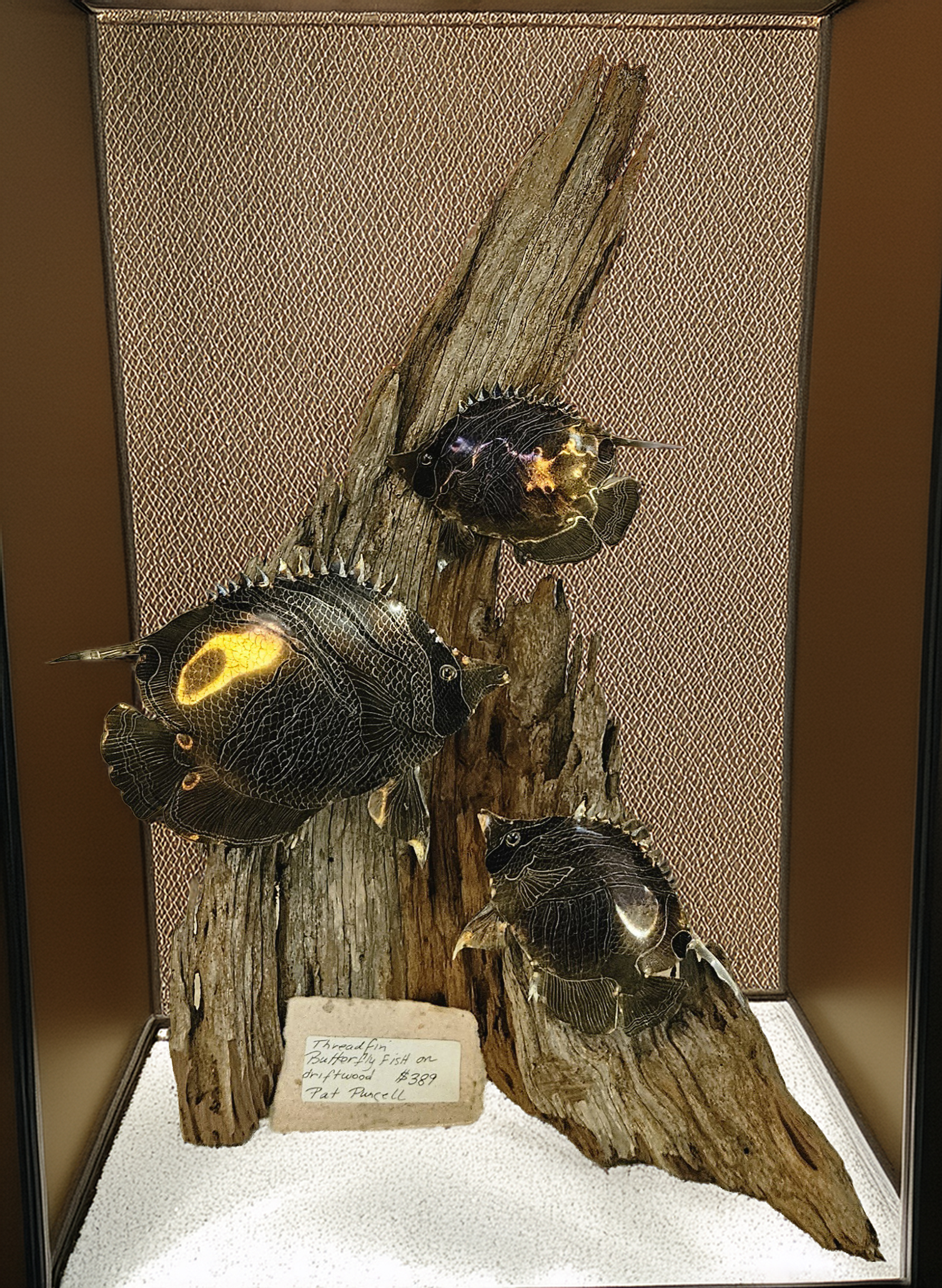 1748033385-METAL FISH ON WOOD